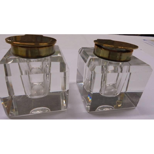 1098 - A pair of glass inkwells and one other.