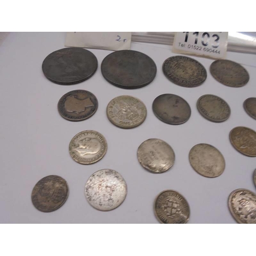 1103 - A collection of silver coins including American Eagle silver dollar.