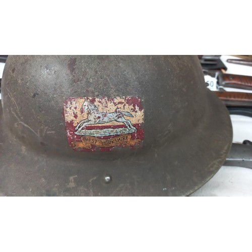 2260 - A WWI West Yorkshire Regiment helmet.