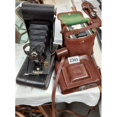 2305 - Four vintage cameras including two with leather cases.