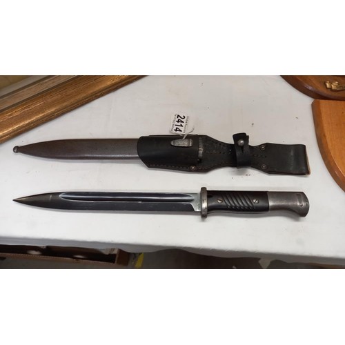 2414 - A German K98 bayonet in scabbard.