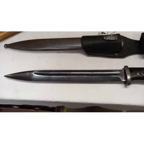 2414 - A German K98 bayonet in scabbard.