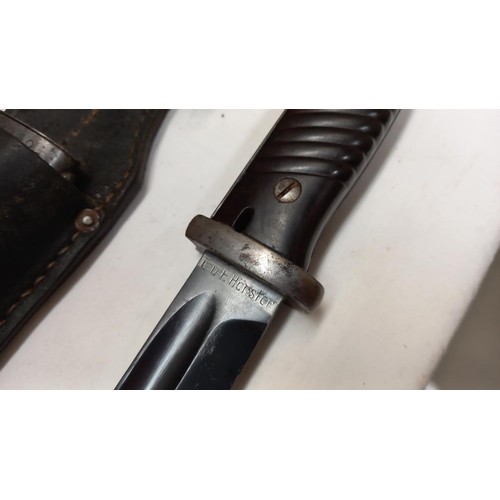 2414 - A German K98 bayonet in scabbard.