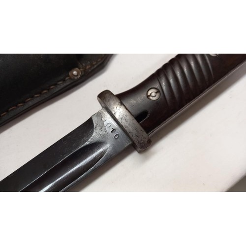 2414 - A German K98 bayonet in scabbard.