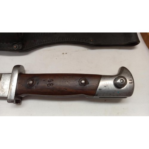 2413 - A bayonet in scabbard.