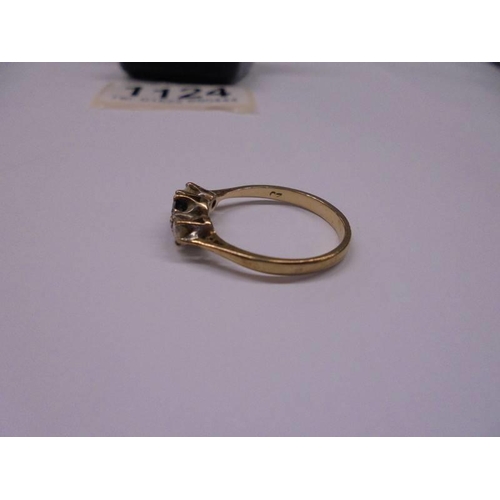 1124 - A 9ct gold ring set sapphire and white stones, size M, 1.69 grams