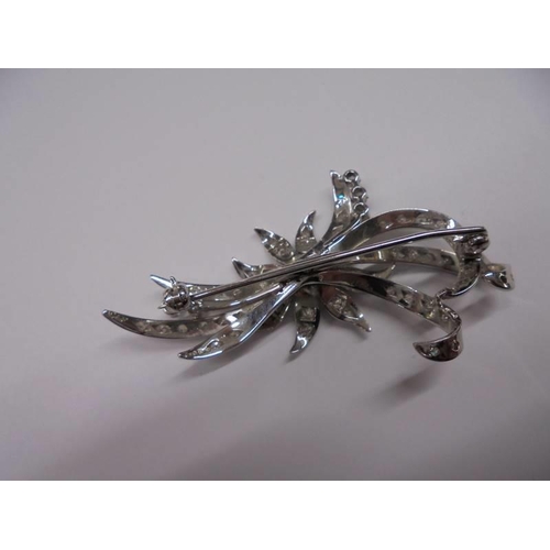 1126 - An exquisite 18ct white gold diamond set floral spray brooch.