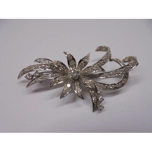 1126 - An exquisite 18ct white gold diamond set floral spray brooch.