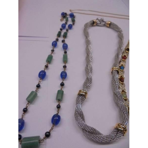 1128 - Four good quality necklaces and a yellow metal chain.