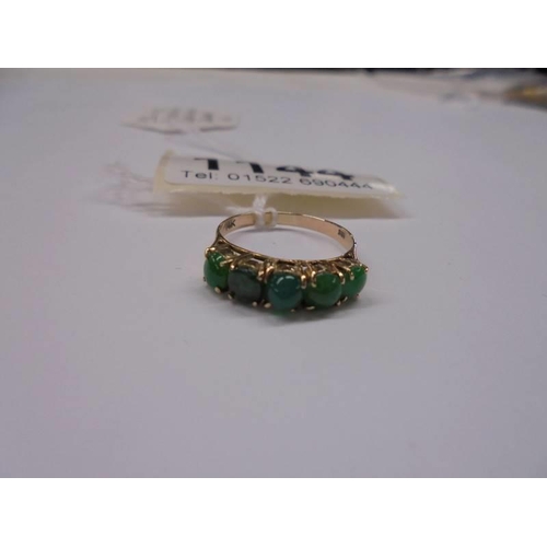 1144 - A five stone ring set with green stones in a claw setting stamped 14ct gold, size L half, 1.85 grams... 