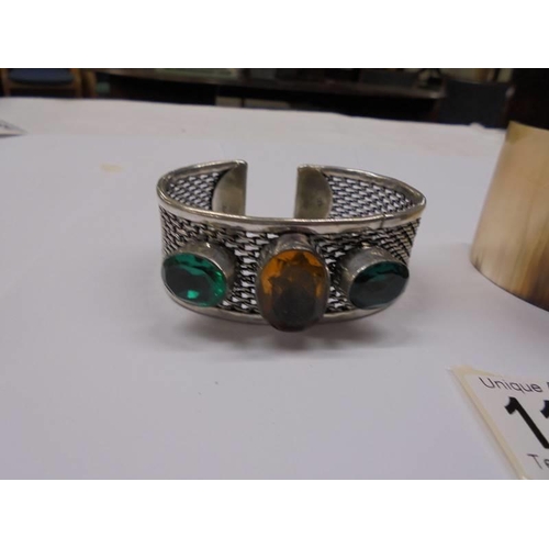 1152 - Two vintage cuff bangles, one in horn, the other stone set in silver.