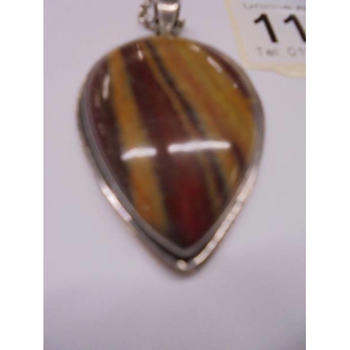 1157 - A banded jasper pendant and chain in silver.