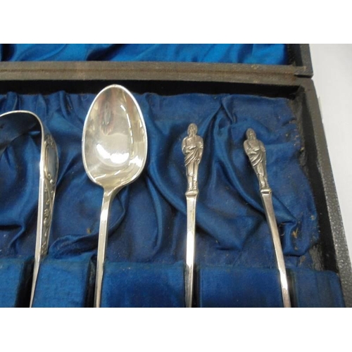 1162 - A cased set of six silver apostle spoons with sugar nips.