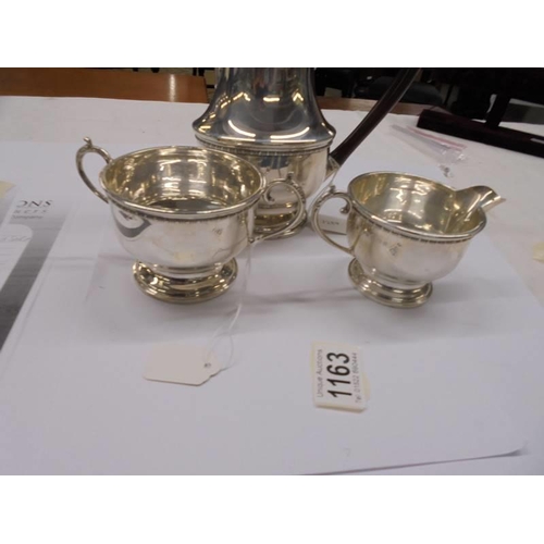 1163 - A silver coffee pot, sugar bowl and milk jug,