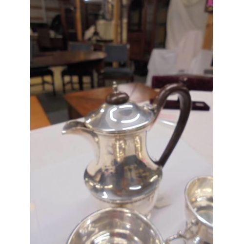 1163 - A silver coffee pot, sugar bowl and milk jug,