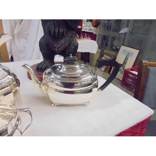 1164 - A four piece silver tea set, approximately 44 ounces.