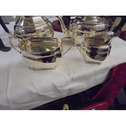 1164 - A four piece silver tea set, approximately 44 ounces.