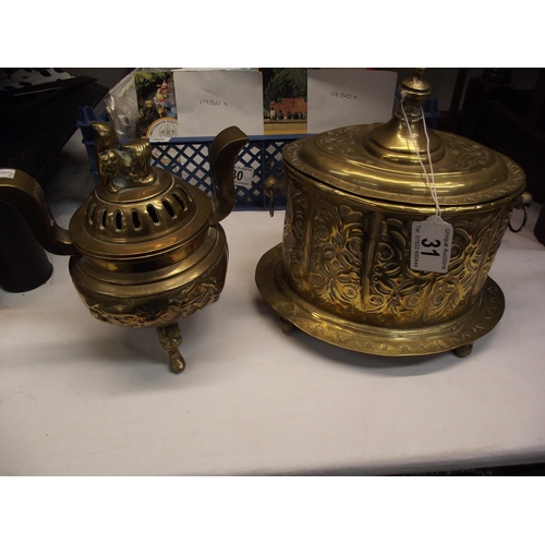 31 - A Chinese brass insence burner and a hammered brass tobacco tin