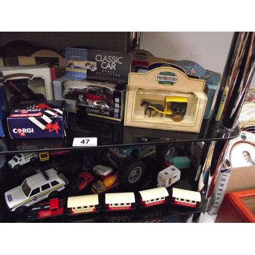 47 - A quantity of die cast cars etc including boxed items