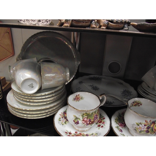 54 - An 18 piece teaset, 12 piece teaset large cake platter and 2 cups and saucers