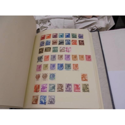 1173 - An album of European stamps and two part albums of world stamps.