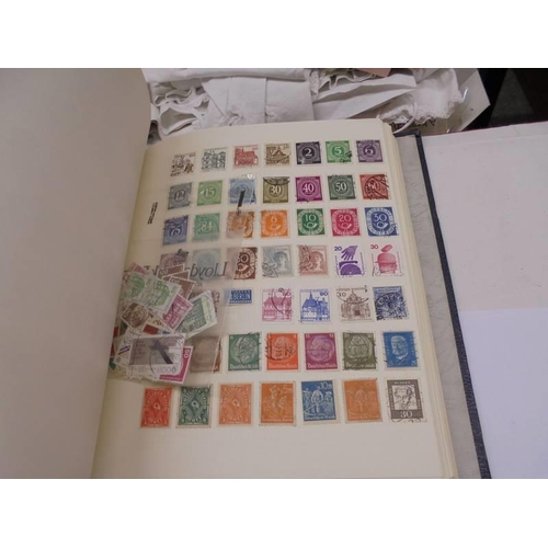 1173 - An album of European stamps and two part albums of world stamps.