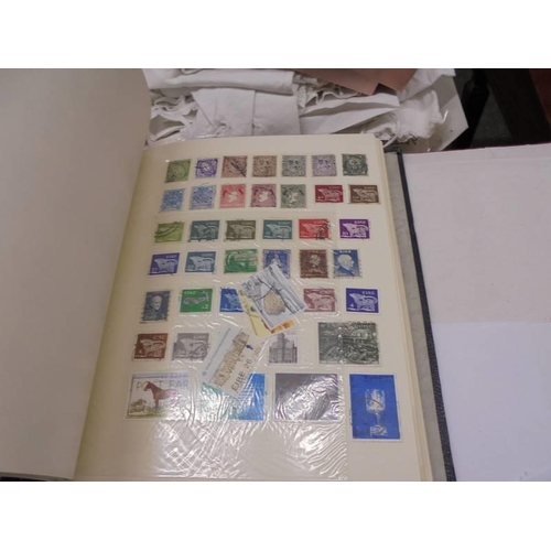 1173 - An album of European stamps and two part albums of world stamps.