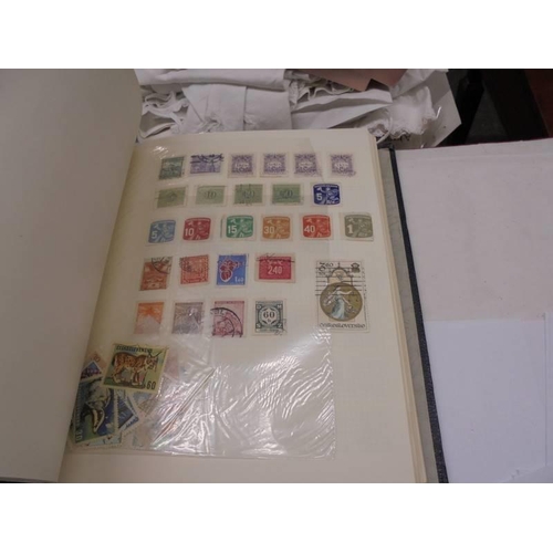 1173 - An album of European stamps and two part albums of world stamps.