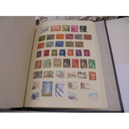 1173 - An album of European stamps and two part albums of world stamps.