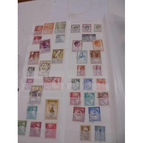 1174 - An album of world stamps.