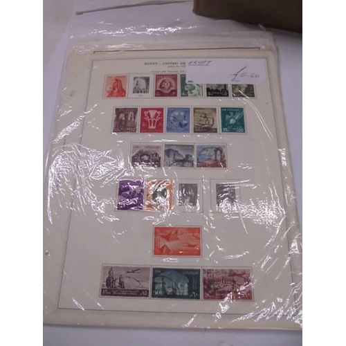 1175 - A box containing a large quantity of mini collections of stamps on sheets from many countries of the... 