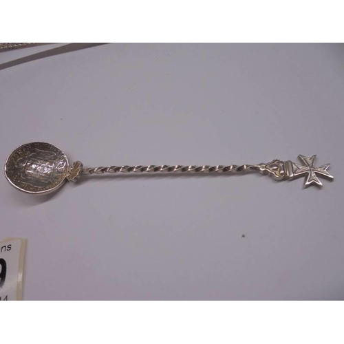 1179 - A silver plate fruit spoon, a pickle fork with silver handle and a spoon with a 1776 coin bowl.