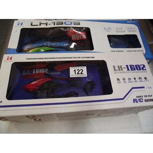 122 - 2 boxed remote controlled helicopters