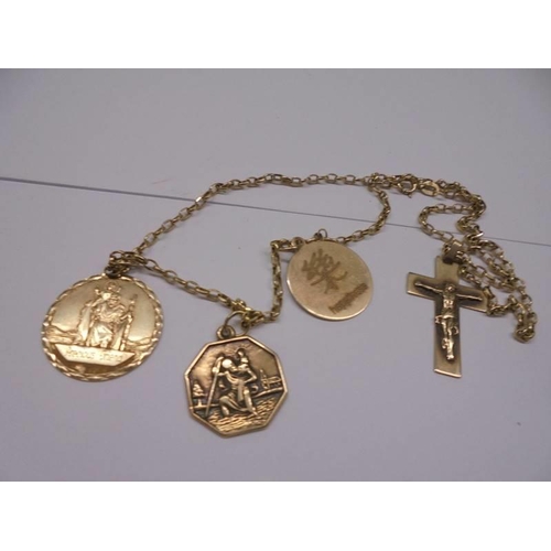 1190 - A gold chain with gold crucifix and 3 gold pendants 7 grams and a white metal ring (possibly white g... 