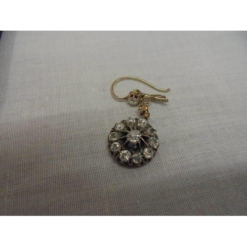 1100A - A pair of diamond earrings, (one stone needs refixing) total weight 5.95 grams.