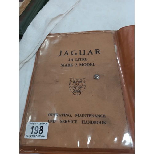 198 - A Jaguar MK2 service handbook & a car mascot