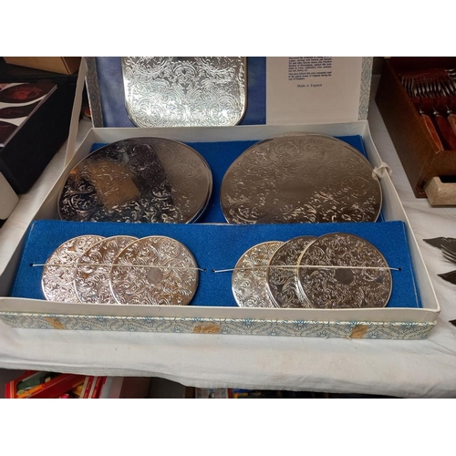 242 - A boxed vintage set of Cavalier silver plated coaster place mats