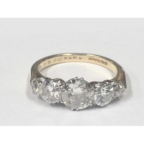 1100E - An 18ct 5 stone ring set early round brilliant/old cut diamonds, estimated diamond weight 4.25 metri... 