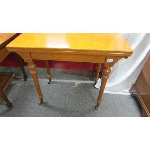 1507 - A light oak fold over games table on castors, COLLECT ONLY.