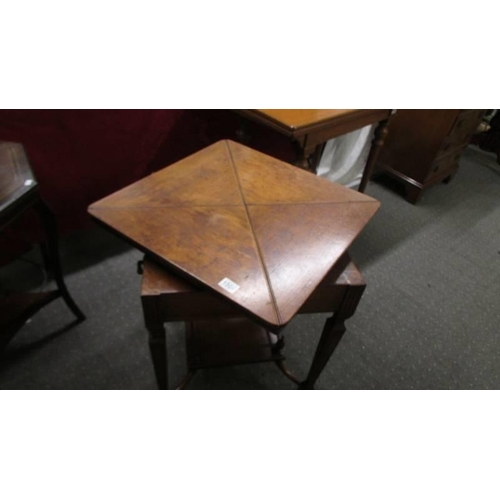 1508 - A Victorian 'envelope' fold out games table on castors, COLLECT ONLY.