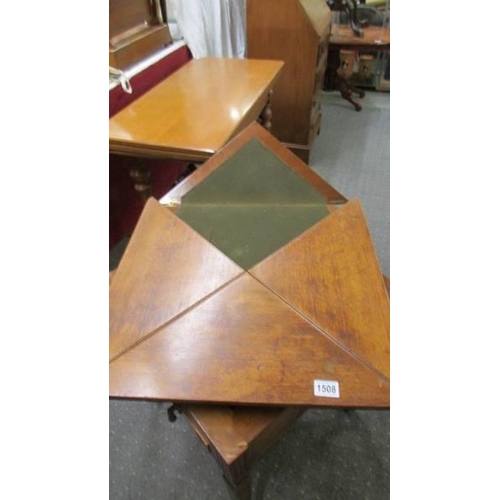 1508 - A Victorian 'envelope' fold out games table on castors, COLLECT ONLY.