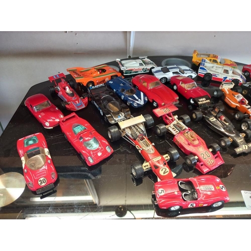 272 - A good selection of unboxed die cast racing cars including Corgi, Matchbox & Polistil etc.