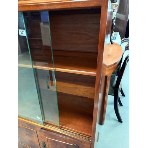 301 - A vintage cabinet with 2 glass doors, approximately 71cm wide x 110cm high COLLECT ONLY.