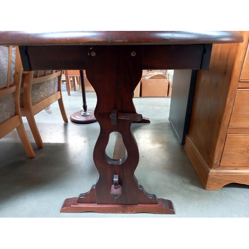 318 - A dark oak oval dining table COLLECT ONLY