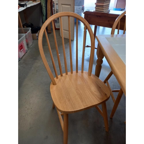 335 - A white tile top table & 4 chairs COLLECT ONLY