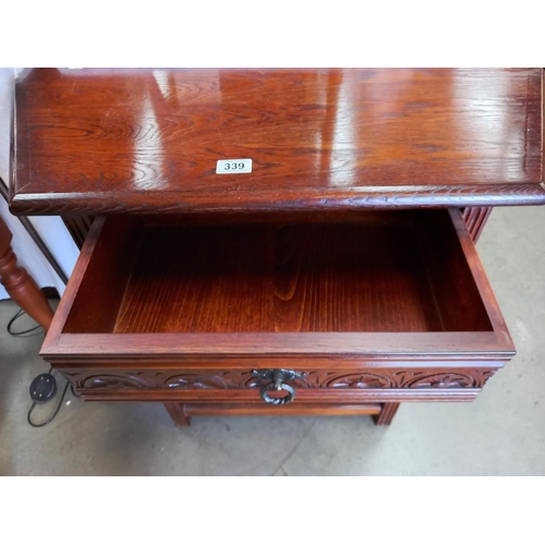 339 - A solid oak hall table with carved drawer COLLECT ONLY