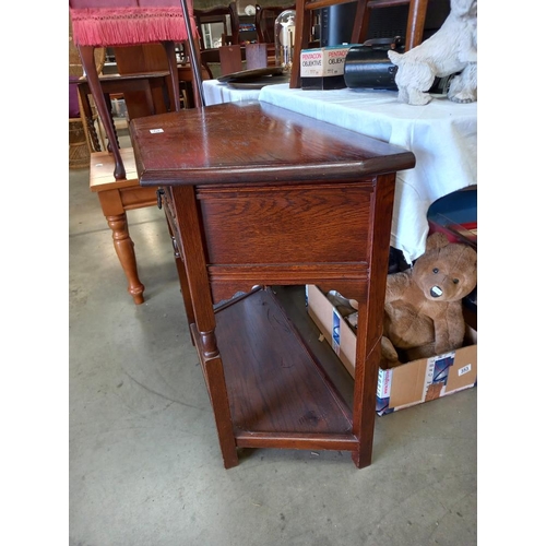 339 - A solid oak hall table with carved drawer COLLECT ONLY