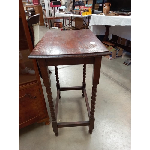 375 - A 1930's oak side table with barley twist legs COLLECT ONLY