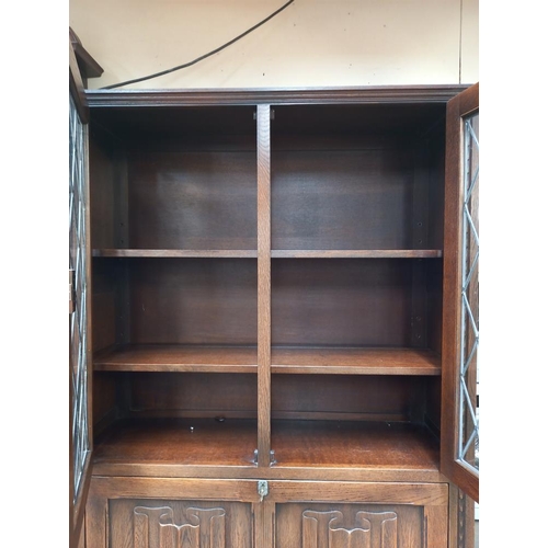 379 - A dark oak bureau bookcase drinks cabinet with drapery front COLLECT ONLY