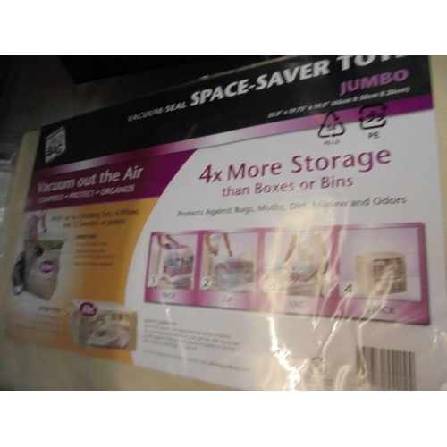 10 - Four new vacuum seal space saver totes.